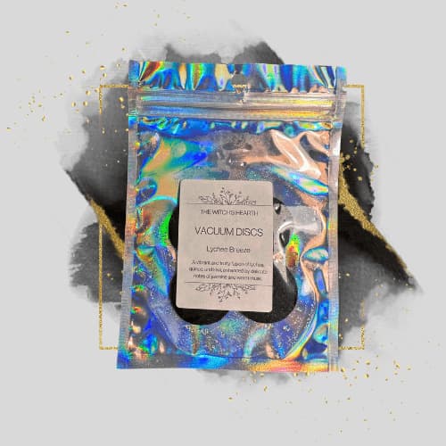 Holographic packaging of vacuum discs with a label on a gray background