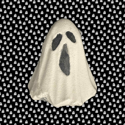 Ghost-shaped bath bomb on a black background with white ghost pattern