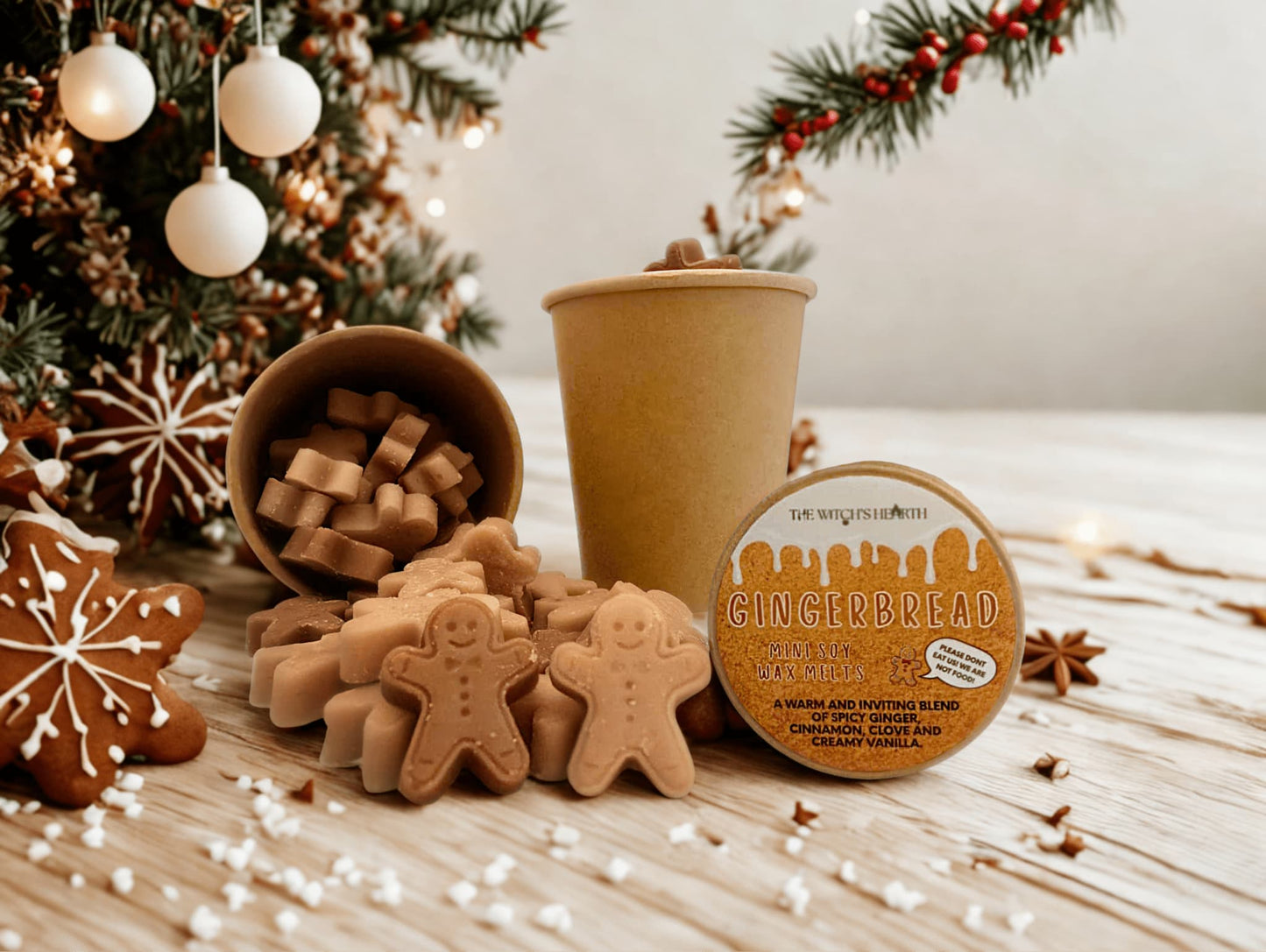 Gingerbread-themed product with cookies and a cup on a festive background