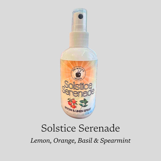 Bottle of Solstice Serenade room and linen spray on a gray background
