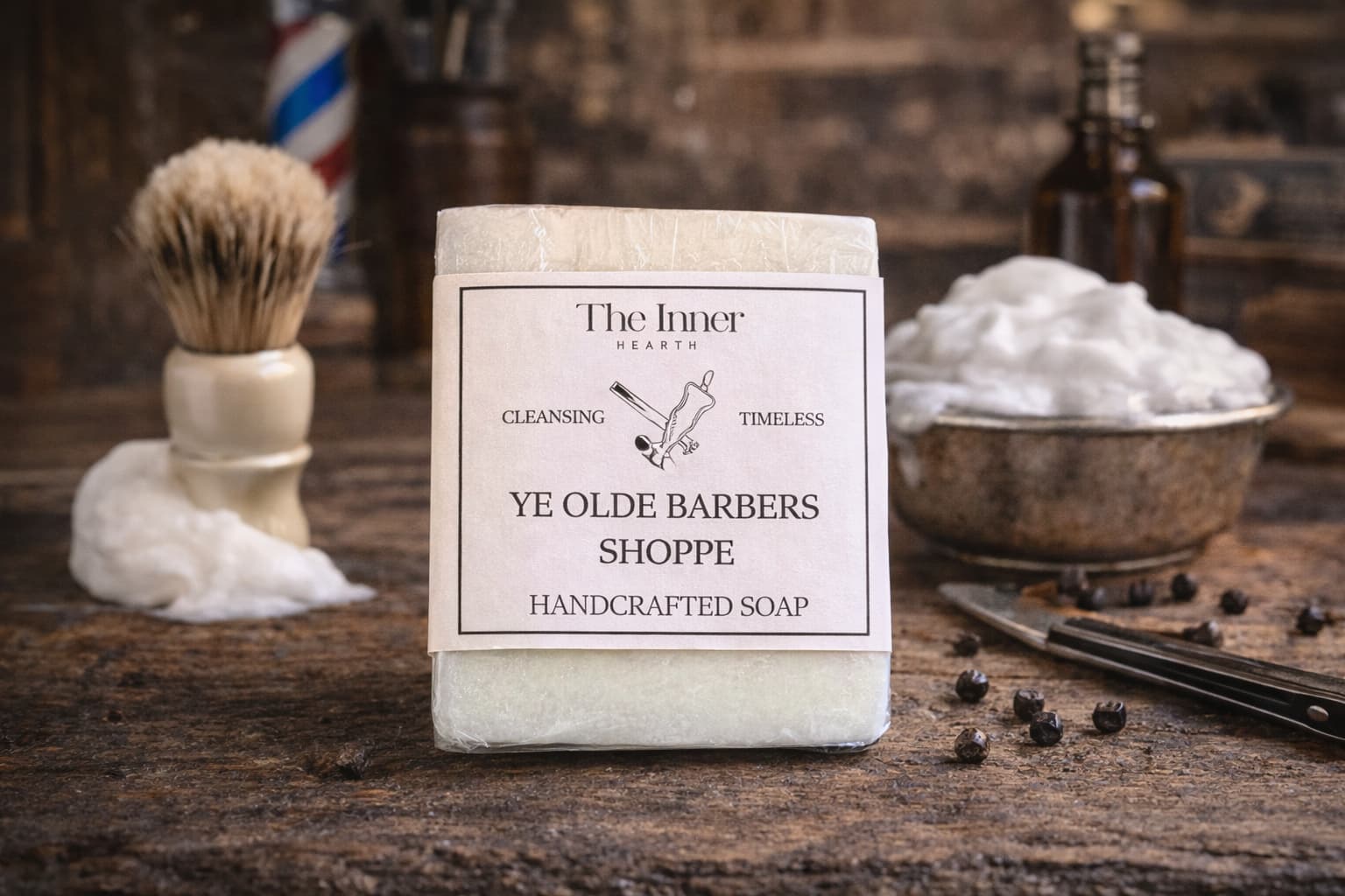 Handcrafted soap bar from Ye Olde Barbers Shoppe with shaving accessories in the background.