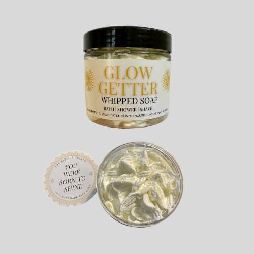 Jar of Glow Getter whipped soap with a label on a light gray background