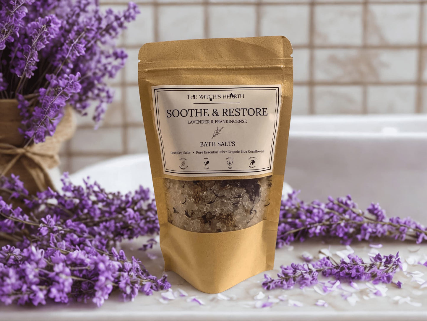 Bag of bath salts with lavender flowers on a bathroom counter