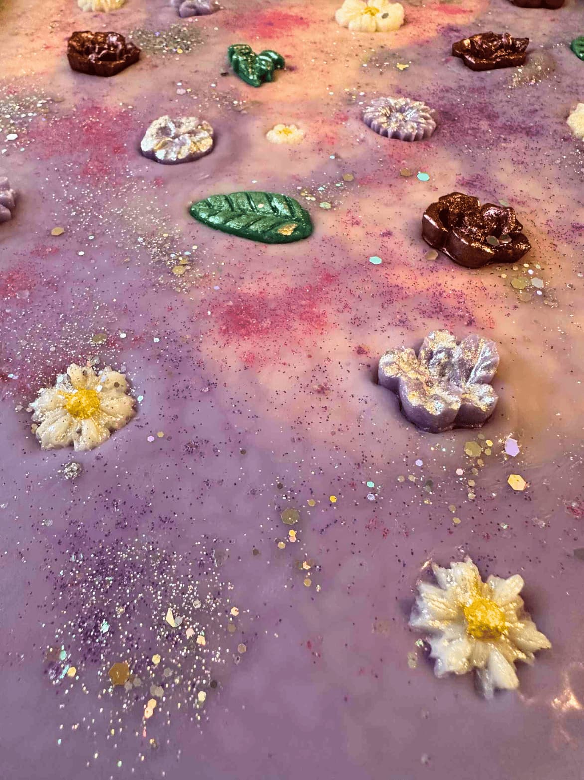 Colorful wax melt brittle including flowers and leaves