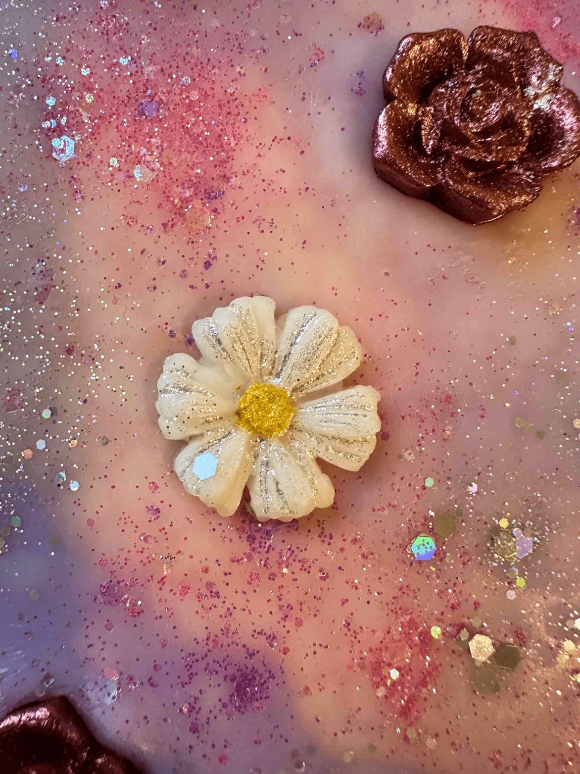 Colorful wax melt brittle including flowers and leaves