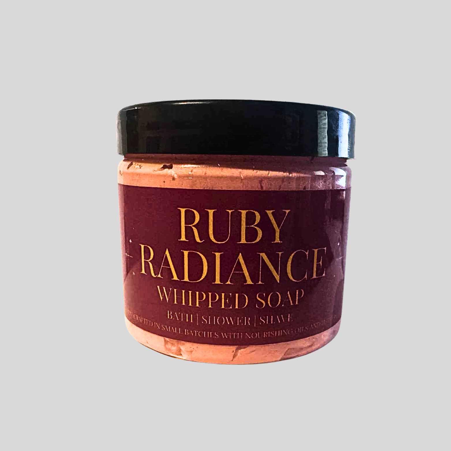Jar of Ruby Radiance whipped soap on a light gray background